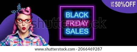 Black Friday Sales, discounts, rebates, offers concept - excited surprised pin up woman in red glasses looking sideways. Purple girl in pinup rockabilly style. Neon light sign. 50% off text.