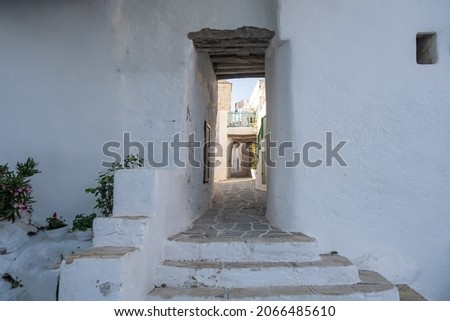 Greece, Cyclades. Folegandros island, Stairs and entrance to Kastro, old castle in Chora Traditional stone paved covered alley called stegadi.