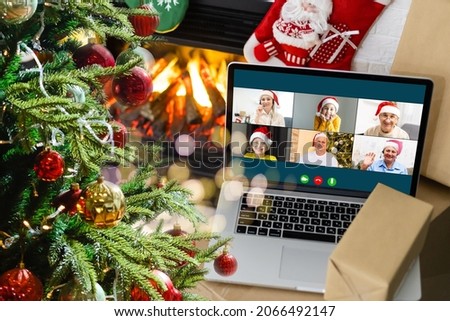 laptop with gift box and christmas lights background.
