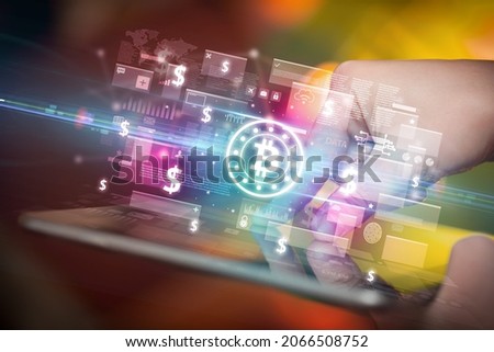 Close-up of a hand using tablet, currency concept