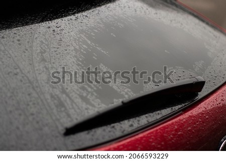 Parts of a wet car. Drops on the surface of the machine. Car after rain.