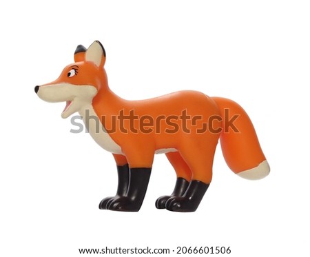 Toy fox made of plastic on a white background. Children's toy. 