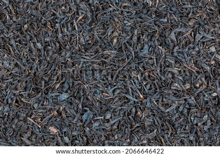 seamless texture and full frame background of flat pile of dry long-term black tea.
