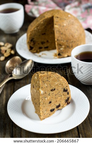 Biscuit cake without baking with poppy seeds, raisins and nuts