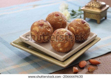 Indian Sweets Panjiri Laddu in a platter Royalty-Free Stock Photo #2066669630
