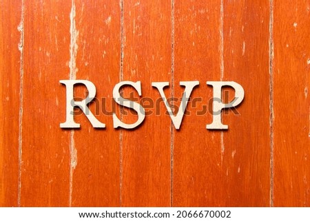 Alphabet letter in word RSVP (Abbreviation of French word répondez s'il vous plaît) on old red color wood plate background