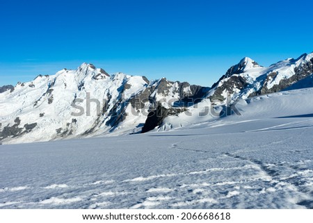 Mountain landscape with snow and clear blue sky