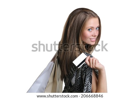 Beautiful young girl with credit card and shopping bag