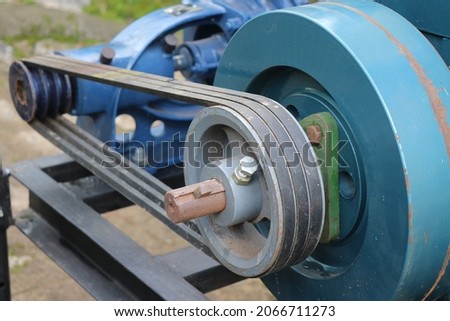 Belt drive of Diesel engine water pump, Pulley and belt transmission view from the centrifugal water pump Royalty-Free Stock Photo #2066711273