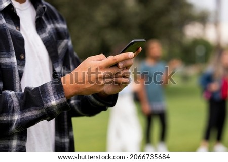 Student checking social media on phone