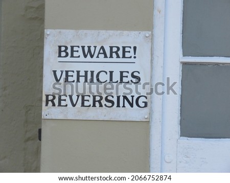 Beware of vehicles reversing warning sign