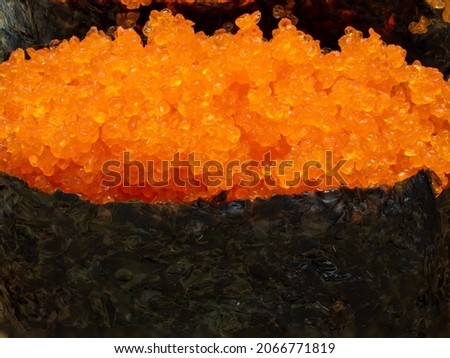 Sushi with shrimp roe or flying fish roe macro photography Ebiko sushi set is a Japanese term for a sushi set that is served on a wooden platter.
