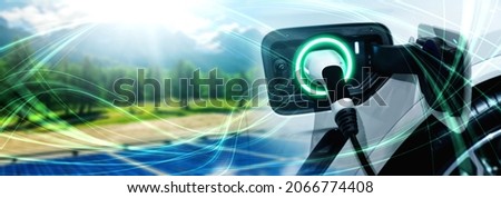 EV charging station for electric car in concept of green sustainable energy produced from renewable resources to supply to charger station in order to reduce CO2 emission . Royalty-Free Stock Photo #2066774408
