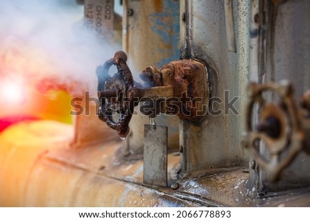 Corrosion rusty through valve tube steam gas leak pipeline at insulation Royalty-Free Stock Photo #2066778893