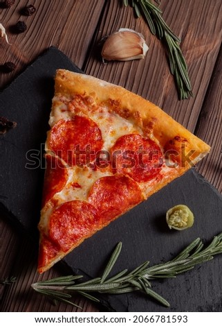 Peperoni pizza. One slice of pizza. Menu for the restaurant.