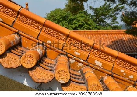 Shenzhen,China,september 25th 2019. Old style roof tiles on a Chinese Buddhist temple inside the grounds of the Fairy Lake Botanical gardens. 