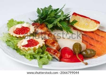 Image of dish with fish snack on white background