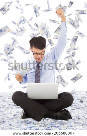 business man watching laptop and raising a hand