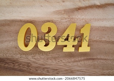 Golden Arabic numerals 0341 on a dark brown to white wood grain background.