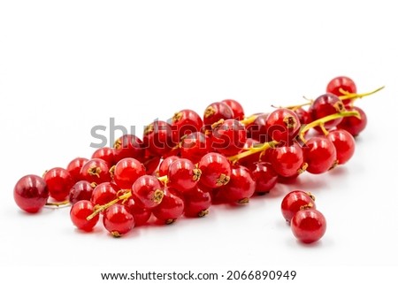 Redcurrant on a white background. Along with the mature Redcurrant shade. close up Royalty-Free Stock Photo #2066890949