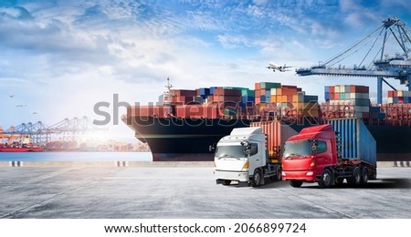 Container cargo freight ship during discharging at industrial port and move containers to container yard by trucks, cargo plane, logistic import export background and transport industry concept Royalty-Free Stock Photo #2066899724