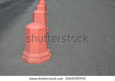 dividing blocks on the road. protective cone for parking. advertising picture. paved road.