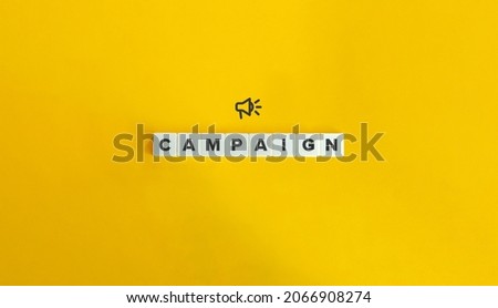 Campaign banner and conceptual image. Block letter tiles on bright orange background. Minimal aesthetics.