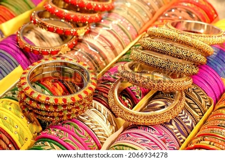 Indian colorful bangles displayed in local shop in a market of Pune, India, These bangles are made of Glass used as beauty accessories by Indian women. Royalty-Free Stock Photo #2066934278