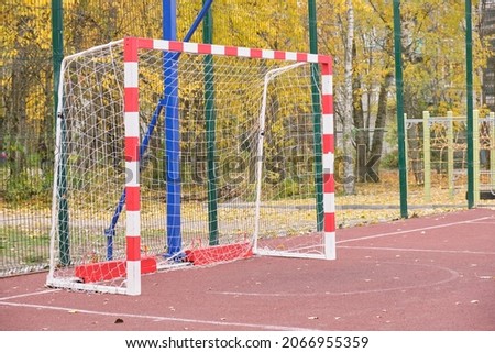 Outdoor sports ground. empty soccer goal Active healthy games. Beautiful autumn landscape background