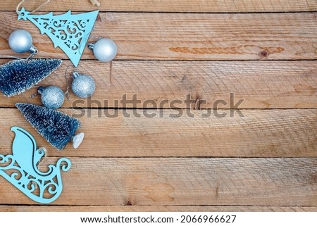 Christmas decorations on wooden background with advertising space