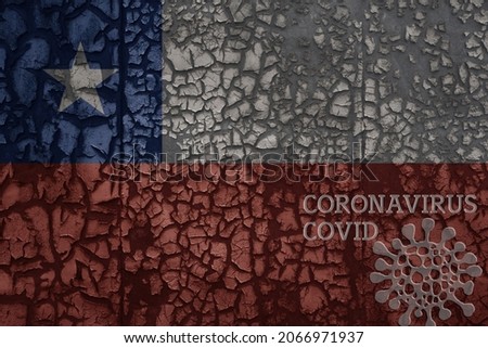 flag of chile on a old vintage metal rusty cracked wall with text coronavirus, covid, and virus picture.
