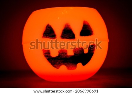 Halloween Pumpkin. Jack-o'-lantern decoration illuminating with burning candle inside