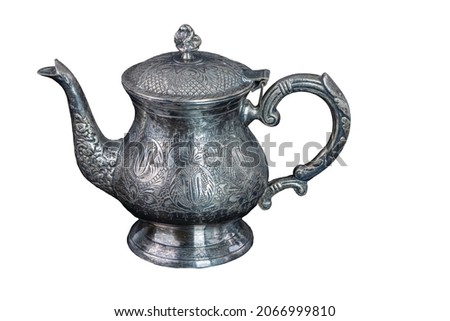 Close up view of vintage silverware teapot isolated on white background. Sweden. Royalty-Free Stock Photo #2066999810