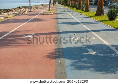walking path and bicycle path side by side in two different colors.