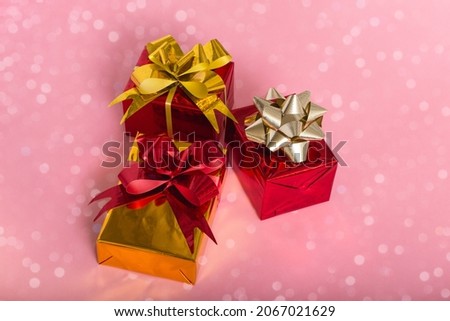 New Year Christmas composition. Gifts on a pink background with bokeh lights. Flat Top View Copy Space New Year 2022 Christmas