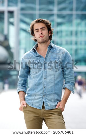 Portrait of an attractive young man posing outdoors