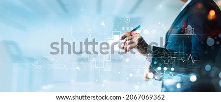 Healthcare business. Businessman analyzing graph data and growth of healthcare on network medical. Emerging disease rising growth and develop people awareness and attention on healthcare and insurance Royalty-Free Stock Photo #2067069362