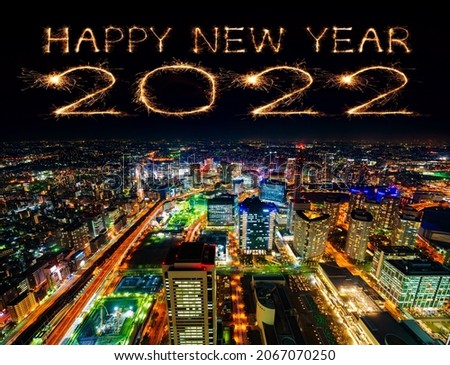 2022 Happy New Year fireworks celebrating over Yokohama cityscape at night, Japan