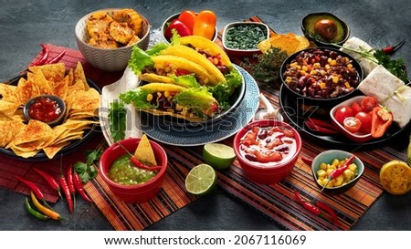 Mexican food, many dishes of the mexican cuisine on dark background Royalty-Free Stock Photo #2067116069