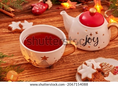Christmas background with Christmas decoration and tea on wood