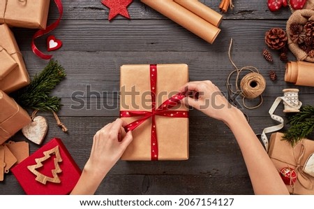 Christmas decoration and presents on wooden table