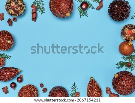 Christmas balls and ribbons on blue background