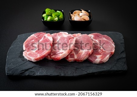 fresh pork neck raw or collar pork on board with ingredients for marinated Royalty-Free Stock Photo #2067156329