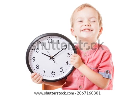 Smiling caucasian boy child holding a clock isolated white background Royalty-Free Stock Photo #2067160301