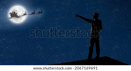 dad is on the roof at night and look at the christmas night sky