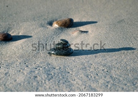 Granite pebbles on a sand sea beach