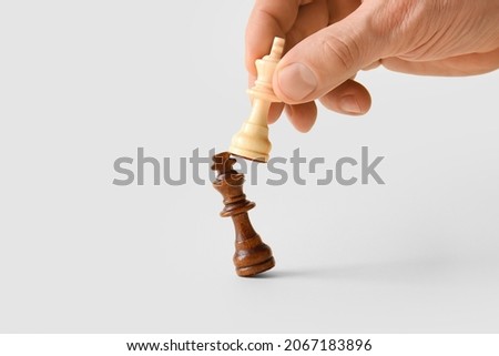 Man playing chess on white background