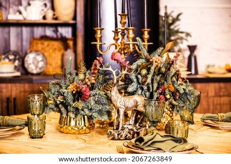 Luxurious New Year dining table decor in the kitchen. Photo