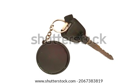 photo of keys and key chains on a white background.  selective focus