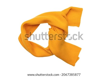 Knitted winter scarf on a white background. The pattern is visible. Royalty-Free Stock Photo #2067385877